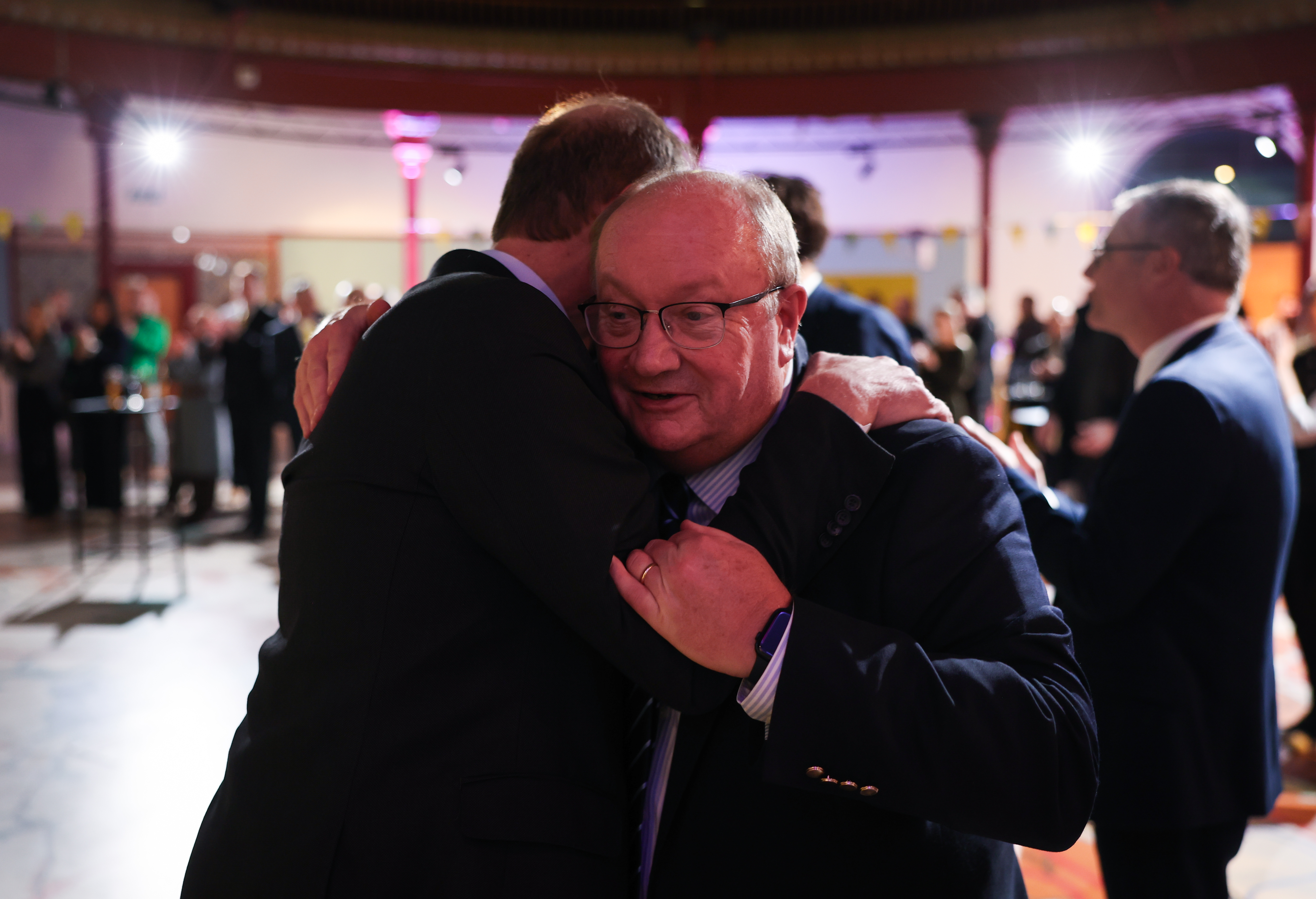 Christian Prudhomme embraces Paul Bush at the Tour de France 2027 route announcement in Leeds City Museum.