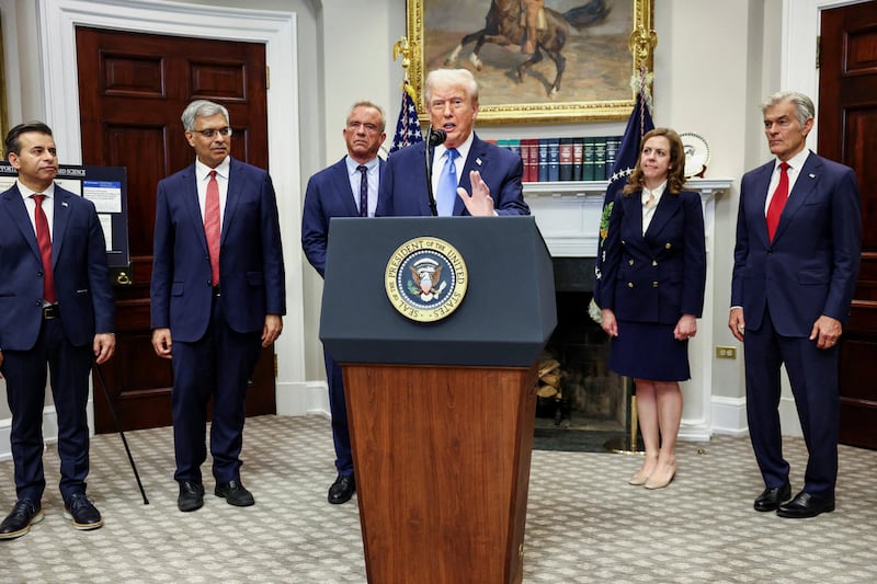 U.S. President Donald Trump, with Administrator of the Centers for Medicare and Medicaid Services Mehmet Oz, Dorothy Fink, acting U.S. assistant secretary for health, U.S. National Institutes of Health (NIH) Director Jay Bhattacharya, U.S. Food and Drug Administration (FDA) Commissioner Dr. Marty Makary, and U.S. Secretary of Health and Human Services Robert F. Kennedy Jr.