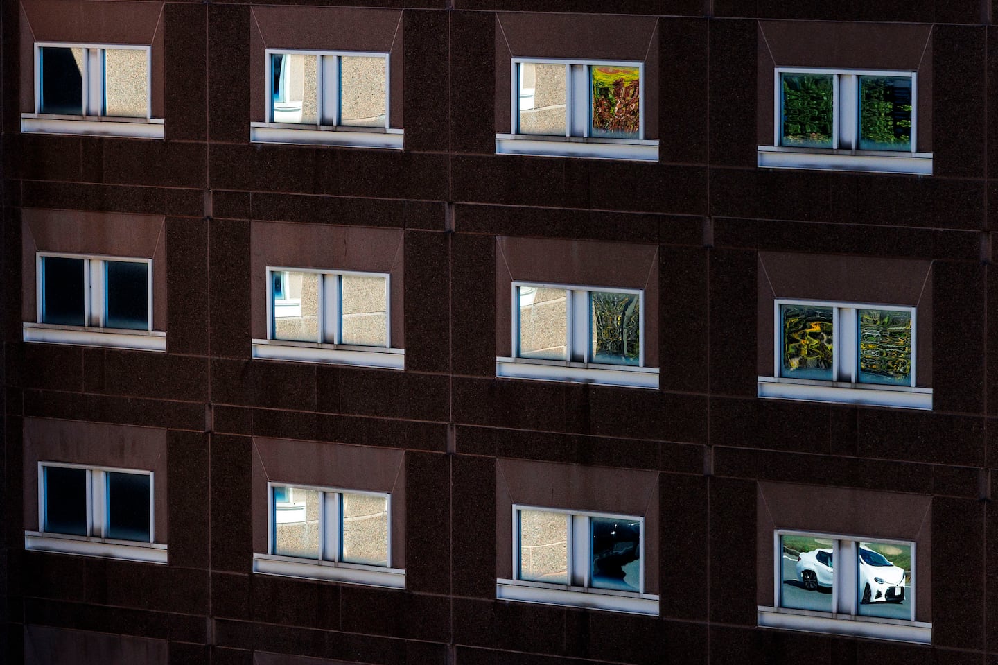 Cars on the Massachusetts Avenue Connector were reflected in the windows of the Suffolk County House of Correction on Sept. 26, 2025.