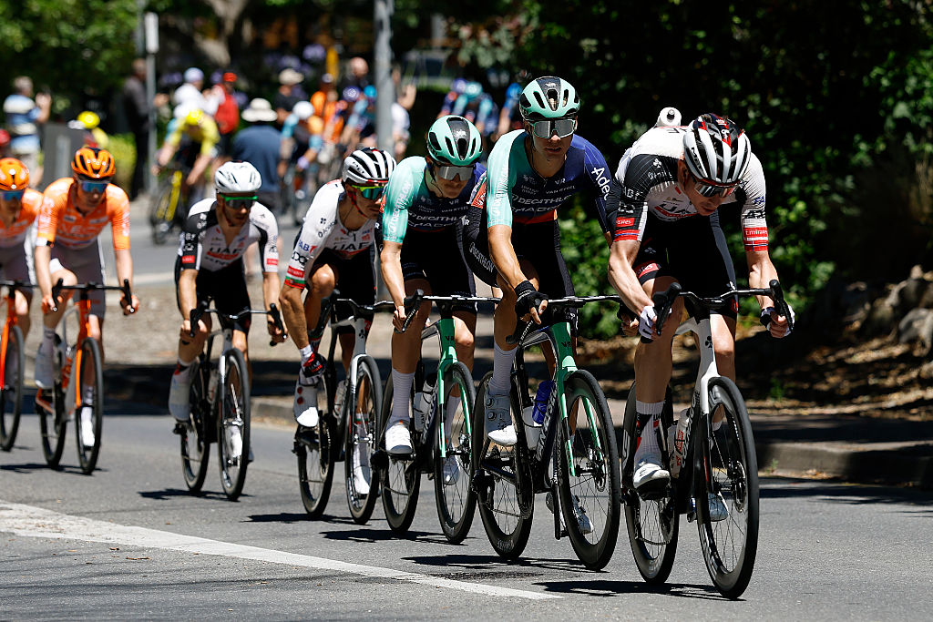 NORWOOD, AUSTRALIA - JANUARY 22: (L-R) Oscar Chamberlain of Australia and Decathlon CMA CGM Team and Vegard Stake Laengen of Norway and UAE Team Emirates leads the peloton during the 26th Santos Tour Down Under 2026, Stage 2 a 148.1km stage from Norwood to Uraidla 495m / #UCIWT / on January 22, 2026 in Norwood, Australia. (Photo by Con Chronis/Getty Images)