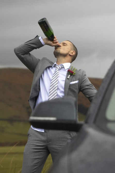 Carl Webster swigging out of a bottle in Coronation Street