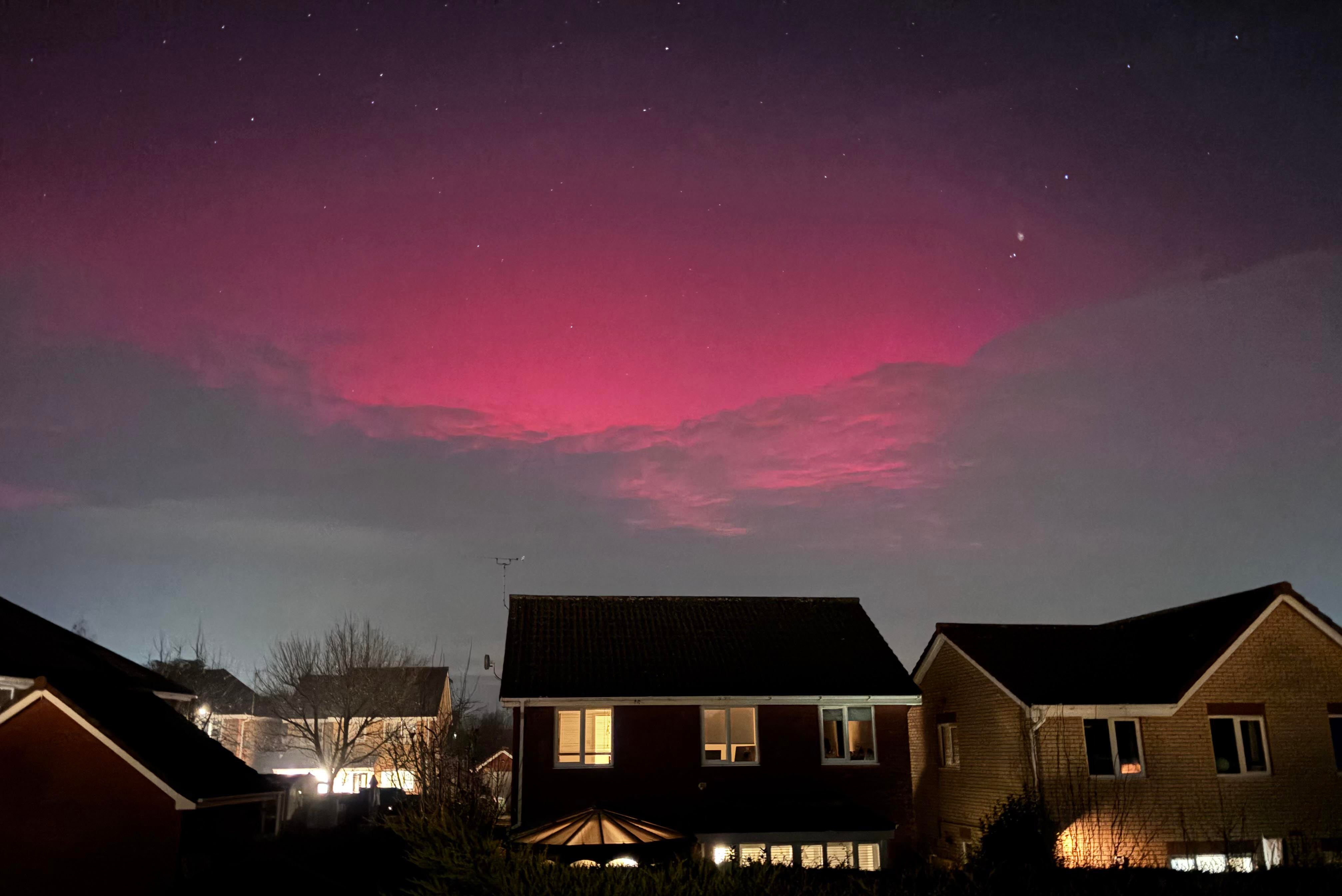 Northern lights illuminate the cloud cover over Rushmere St. Andrew, Ipswich, Suffolk