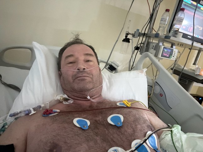 WARNING, GRAPHIC CONTENT - Story from Jam Press (Flesh Eating Bug) Pictured: Mark recovering. Flesh-eating disease eats away fitness fanatic dad-of-three's arm?after sore throat A flesh-eating disease caused by a sore throat ate away a fitness fanatic?s arm. Mark Brooks needed 25 operations to cut away the muscle on his left arm after he was diagnosed with necrotising fasciitis. The 54-year-old blames going to the gym and pulling a muscle in his arm while recovering from a sore throat for the disease developing. ?I was fine and completely healthy and it came completely out of the blue,? Mark said. ?And then all of a sudden, I?m fighting for my life. It was ridiculous. ?I had the worst sore throat I?d ever had. ?Then I went to the gym and did an intense workout." Mark of Grimsby, Lincs, also told?NeedtoKnow: ?I was also fasting so I think that paved the way for the illness. ?While I was working out, I tweaked my elbow which was no big deal. ?Then I developed a fever so I slept like a champion. ?When I woke up, it felt like I?d smashed my elbow really hard on the bedside table. It was killing and I couldn?t use it. ?After that, I developed a fever and started puking like a champion. ?I thought it was bad luck that I had a bad elbow, a sore throat and food poisoning. ?I remember sitting on the carpet thinking that my decision making capacity was diminishing and that I only had one good decision left in me.? The dad-of-three went to hospital and medics assumed he had compartment syndrome, a painful condition from dangerous pressure buildup in a muscle compartment. But he was rushed into surgery when a large bruise appeared out of nowhere. Mark was diagnosed with necrotising fasciitis, or the flesh-eating disease that was eating away his skin and muscle. He had 25 operations to remove the dead skin, brachialis muscle, much of his tricep, a finger flexor and the connective tissue between muscles. The bacteria had also entered his bloodstream, triggering his kidneys to shut down. Mark said: ?I was in ICU for a week. ?They told me I had multi-organ failure. ?That sounded really bad. ?At one point, you could see straight through my arm. ?There was bone with nothing supporting it. ?It was grim to look at.? Mark spent nine weeks in hospital and still has more surgery to come. Doctors used a vacuum pack to keep the limb viable while fighting infection. Skin was later harvested from his leg and back in agonising graft procedures. He said: ?The donor sites were worse than the arm. ?I woke up in the worst pain of my life, crying uncontrollably. ?They removed a muscle from my back and swung it around to rebuild my arm. ?Then they removed fat from my stomach and packed it into my arm to support the exposed bone. ?If I?d gone to an orthopaedic surgeon, they would have amputated. ?One different decision, one different hospital, and my life would be totally different.? The cost of reconstruction has already reached around ?450,000, covered by insurance, with tens of thousands more expected. Mark says he developed PTSD since the ordeal in December 2023. He added: ?The antidote was gratitude. ?Thinking about what I still had, not what I?d lost.? ?Necrotising fasciitis has a mortality rate of around 20 per cent ? but in my case it was closer to 50% so I?m just thankful to be alive and have all my limbs. ?Hopefully, by telling this story, it saves someone else?s life.? ENDS