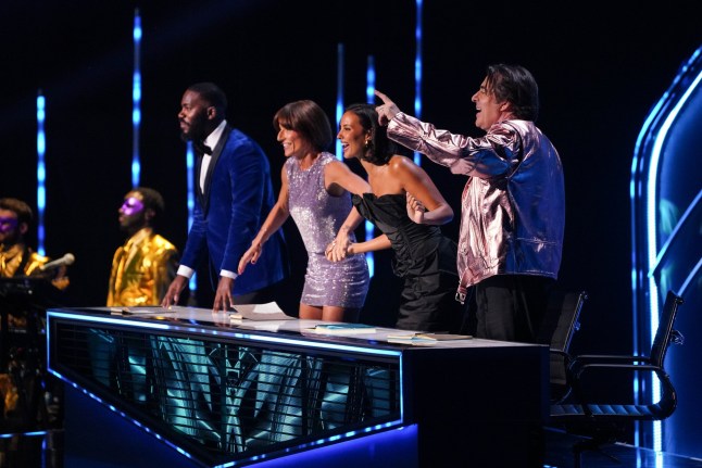 From Bandicoot TV The Masked Singer: SR7: Ep1 on ITV1 and ITVX Pictured: Mo Gilligan, Davina McCall, Maya Jama and Jonathan Ross. This photograph is (C) Bandicoot TV and can only be reproduced for editorial purposes directly in connection with the programme or event mentioned above, or ITV plc. This photograph must not be manipulated [excluding basic cropping] in a manner which alters the visual appearance of the person photographed deemed detrimental or inappropriate by ITV plc Picture Publicity. This photograph must not be syndicated to any other company, publication or website, or permanently archived, without the express written permission of ITV Picture Publicity. Full Terms and conditions are available on the website www.itv.com/presscentre/itvpictures/terms