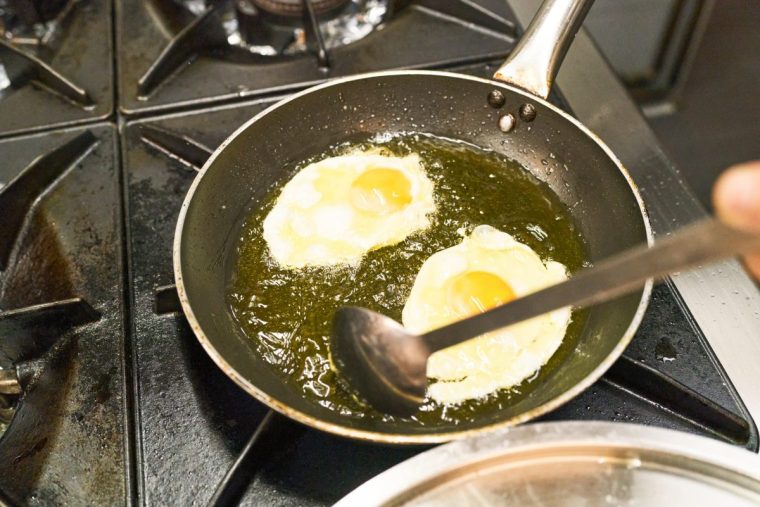 Two fried eggs being cooked