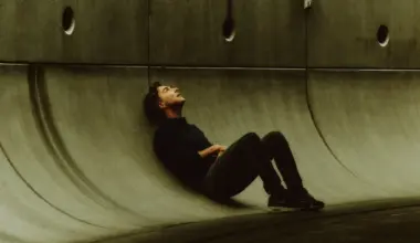 Shawn Levy sitting against Star Wars set in a photoshoot