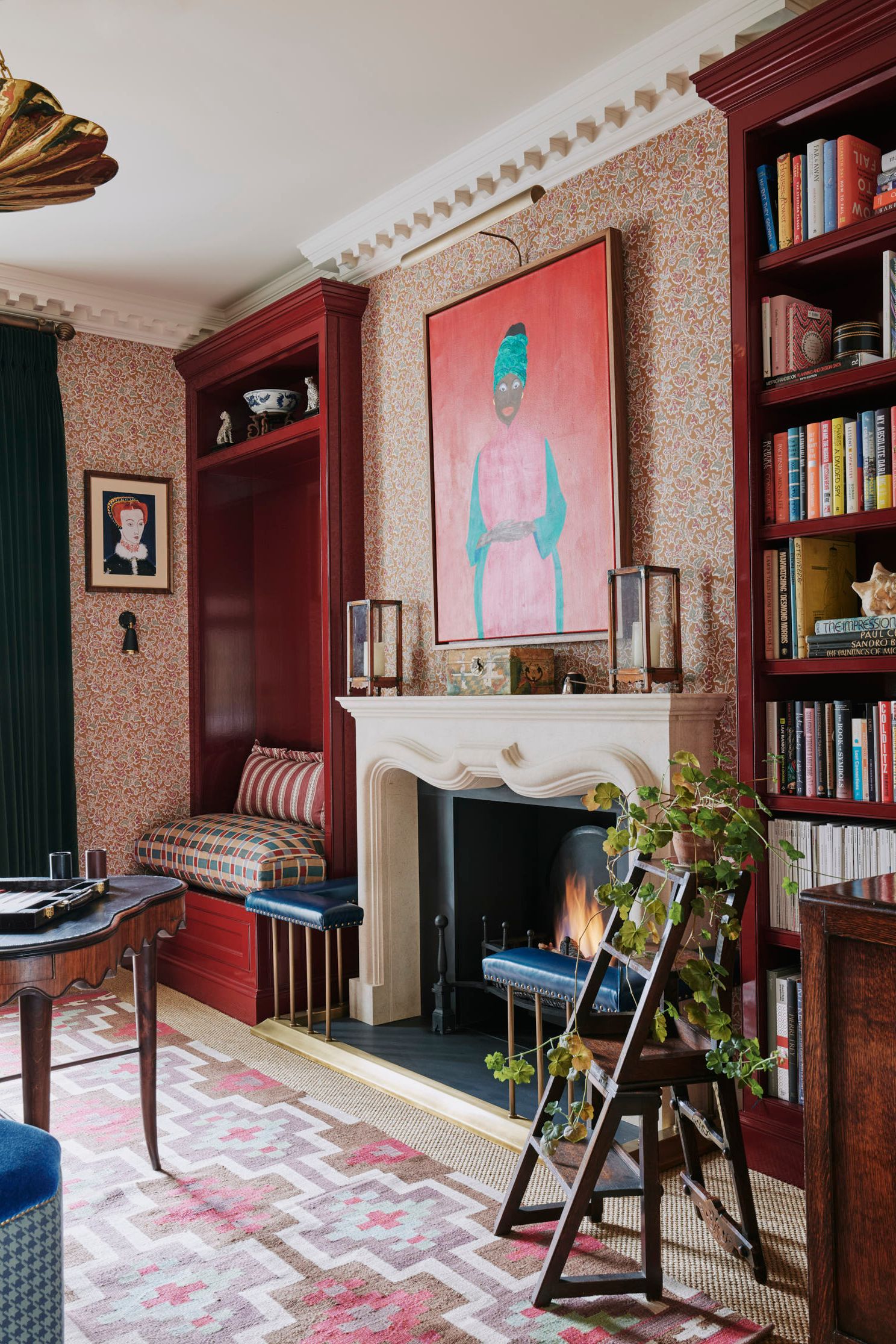 Image may contain Fireplace Indoors Interior Design Home Decor Furniture Bookcase Person and Hearth