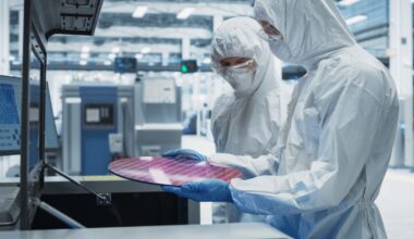 TSMC - technicians inspecting semiconductor components in a factory.jpg