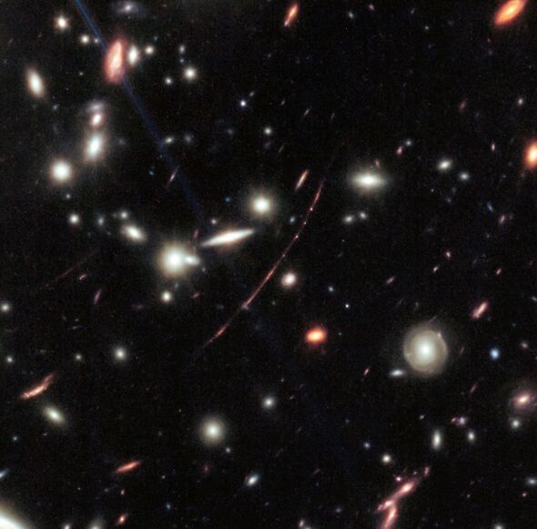This image from NASA’s James Webb Space Telescope shows a massive galaxy cluster called WHL0137-08, This image from NASA’s James Webb Space Telescope shows a massive galaxy cluster called WHL0137-08,