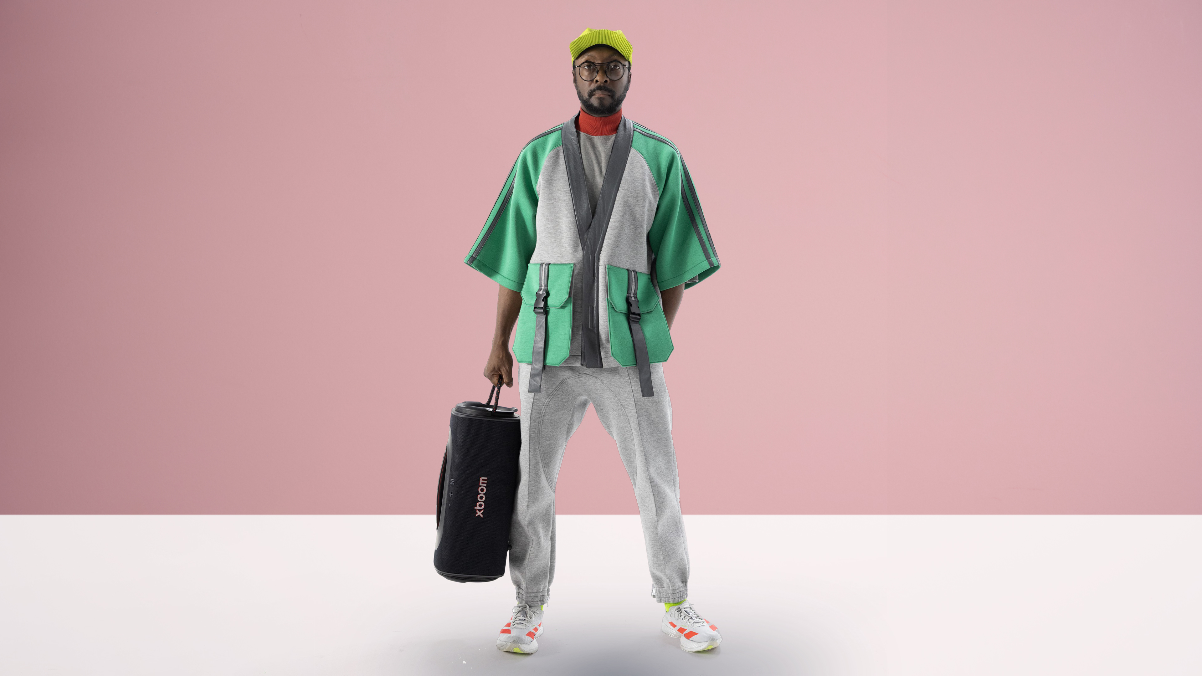 will.i.am holding an LG Stage 501 speaker