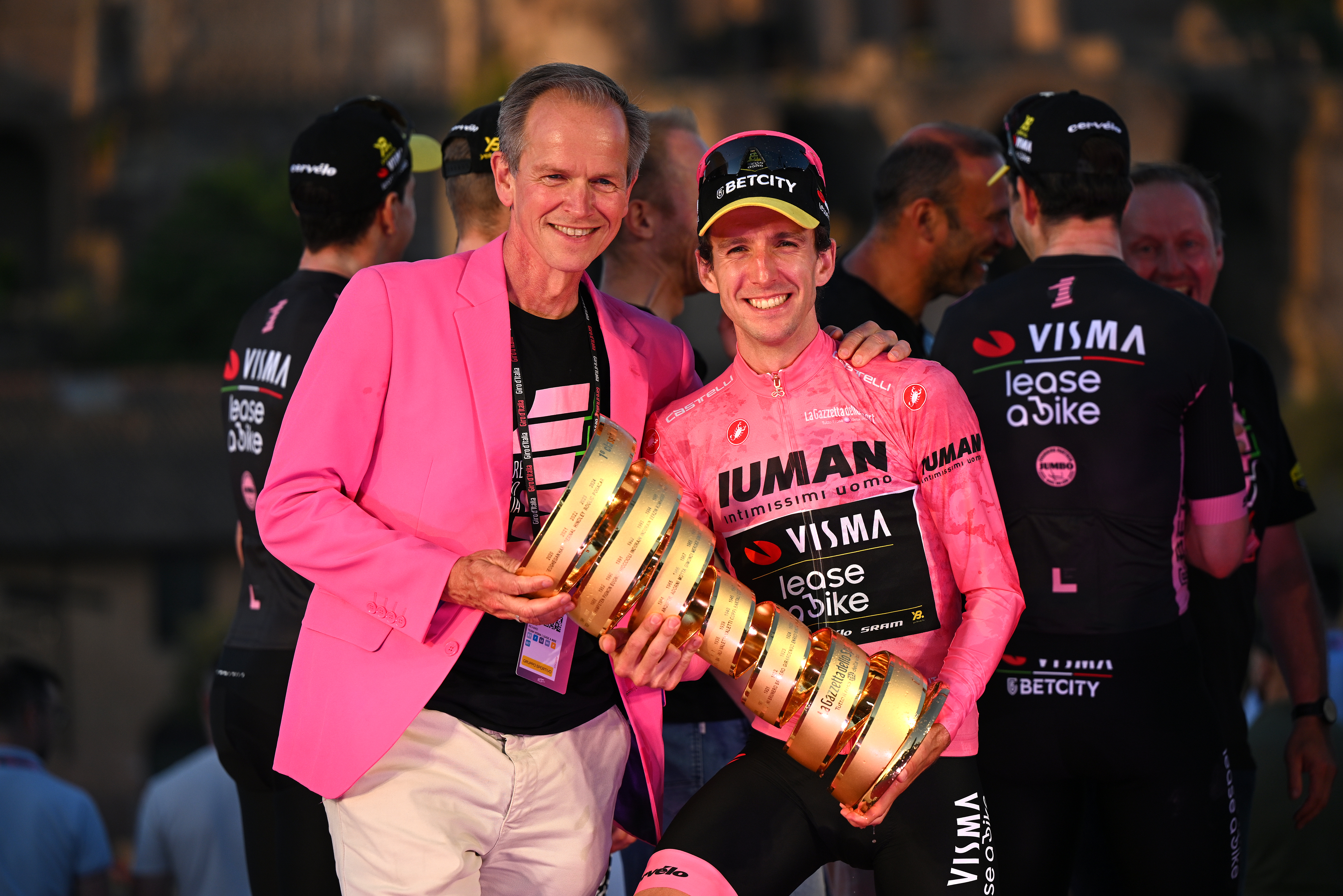 ROME, ITALY - JUNE 01: (L-R) Richard Plugge CEO of Team Visma | Lease a Bike and Simon Yates of Great Britain and Team Visma | Lease a Bike celebrate at podium as Pink Leader Jersey winner with the Trofeo Senza Fine during the 108th Giro d'Italia 2025, Stage 21 a 144.8km stage from Rome to Rome / #UCIWT / on June 01, 2025 in Rome, Italy. (Photo by Dario Belingheri/Getty Images)