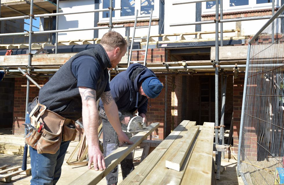 A stock image of builders working