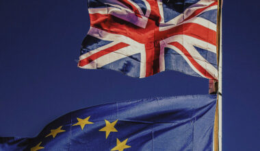 Flags of the United Kingdom and European Union. Photo by Rocco Dipoppa at Unsplash