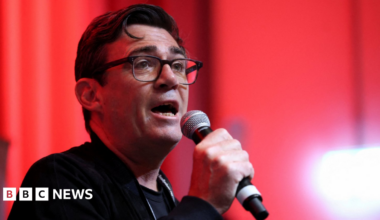 Thin, red banner promoting the Politics Essential newsletter with text saying, “Get the latest political analysis and big moments, delivered straight to your inbox every weekday”. There is also an image of the Houses of Parliament.