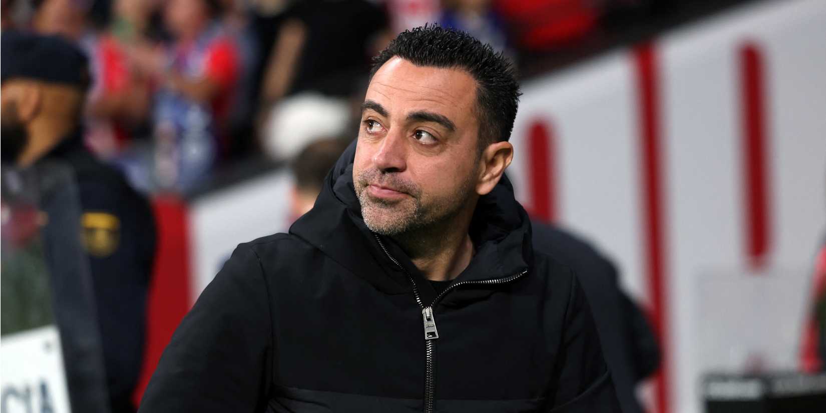 Barcelona head coach Xavi looks on from the touchline