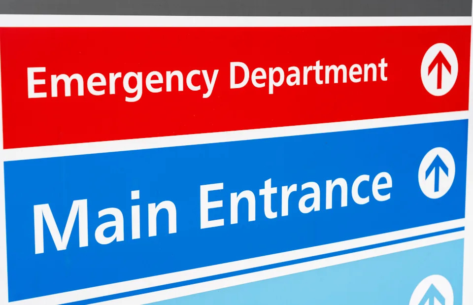 Signs directing patients to the departments of a British hospital.