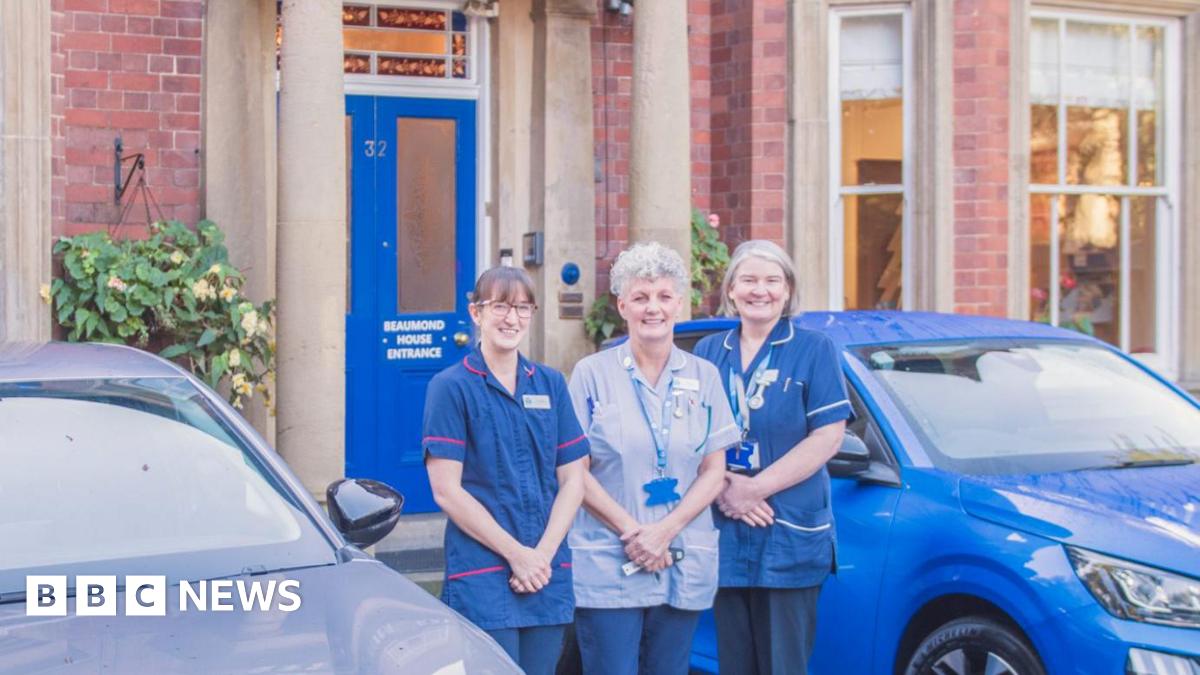 Beaumond House Hospice Care staff stood outside their headquarters, a large Victorian building in Newark