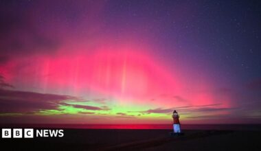 Donald Trump and Keir Starmer sit in a formal drawing room setting  on arm chairs with US and UK  flags behind them. Both have serious expressions and are looking out and not at each other.