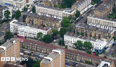 An aerial shot of tower blocks and houses