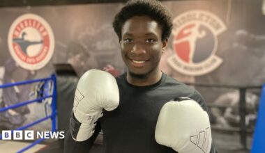 Divine in the gym with boxing gloves on
