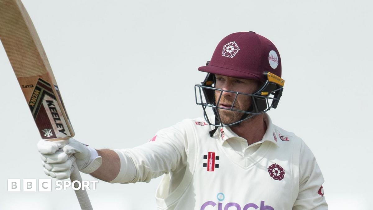 Northamptonshire's Luke Procter raises his bat