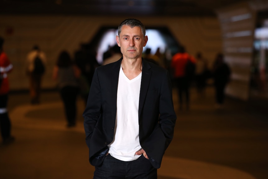 Billy Tucker in a jacket and t-shirt is a young man looking at the camera