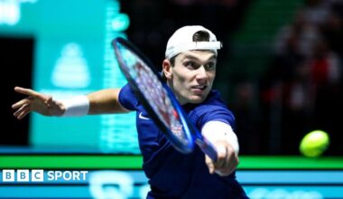 Luke Littler celebrates winning the 2026 PDC World Championship as tickertape falls