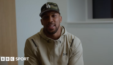 Anthony Joshua sits in front of a camera for a Youtube video