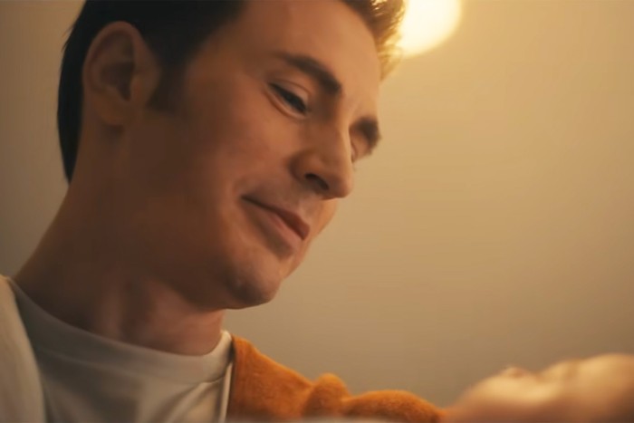 Chris Evans stars in Avengers: Doomsday; in this scene, Steve Rogers is looking down fondly at a baby in his arms