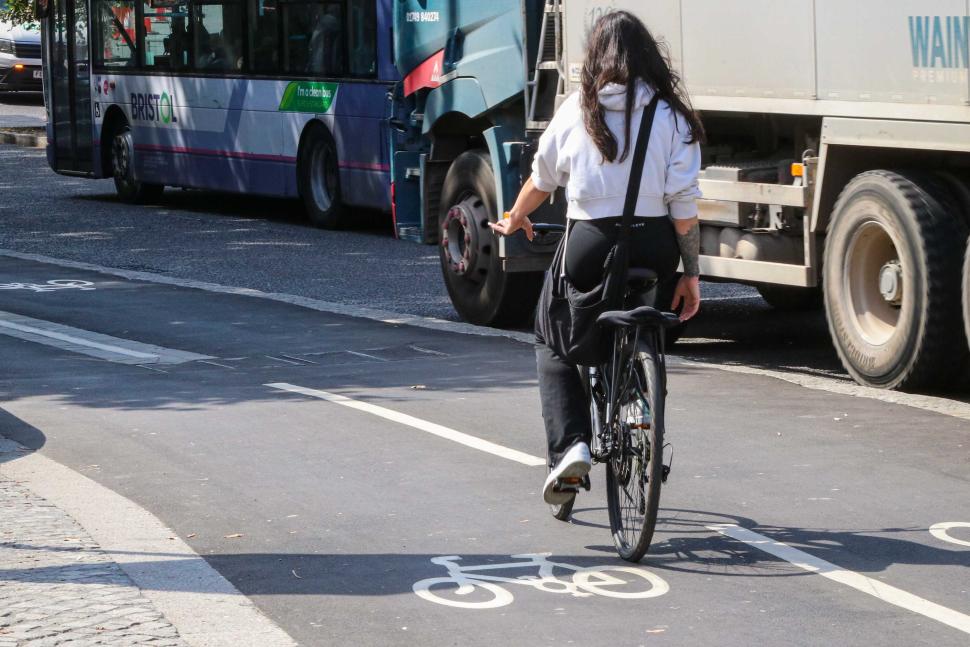 Commuting cyclist in cycle lane.jpg