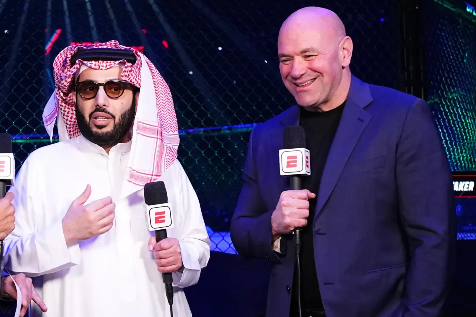 RIYADH, SAUDI ARABIA - JUNE 22: (L-R) Jon Anik, His Excellency Turki Alalshikh, and UFC CEO Dana White are seen on the broadcast during the UFC Fight Night event at Kingdom Arena on June 22, 2024 in Riyadh, Saudi Arabia. (Photo by Chris Unger/Zuffa LLC via Getty Images)