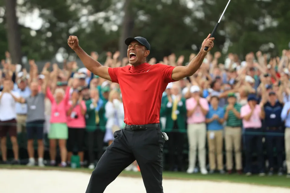 AUGUSTA, GEORGIA - APRIL 14: Tiger Woods (L) of the United States celebrates on the 18th green after winning the Masters at Augusta National Golf Club on April 14, 2019 in Augusta, Georgia. (Photo by Andrew Redington/Getty Images)