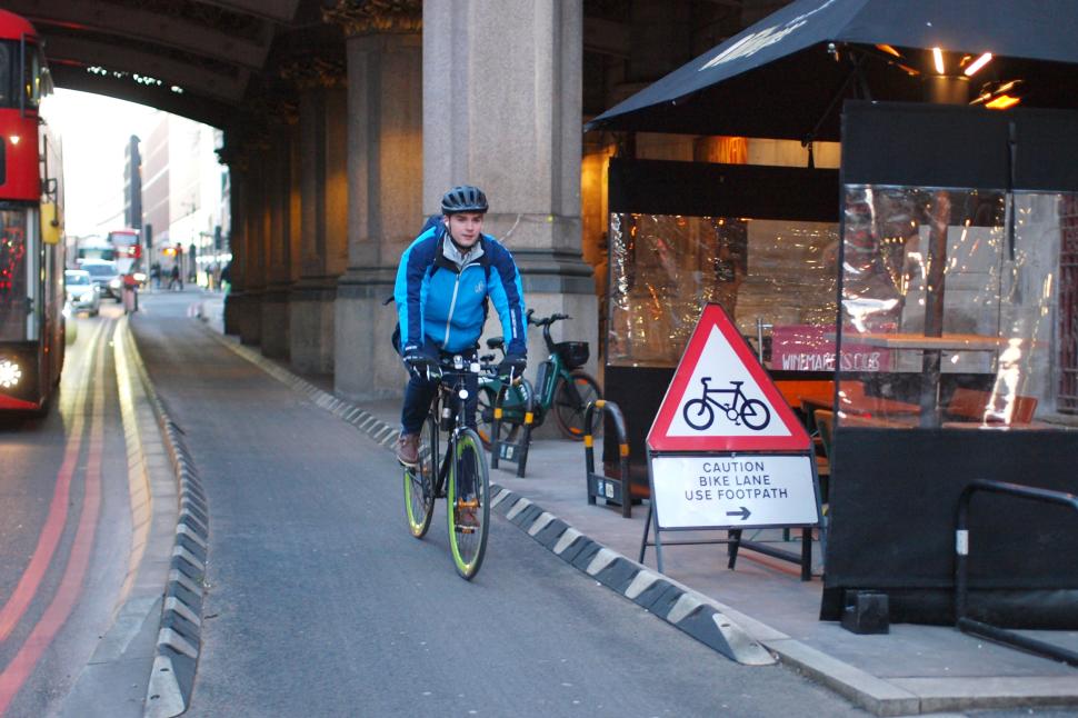 Cyclist in London caution bike lane use footpath - copyright Simon MacMichael