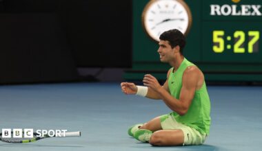 Carlos Alcaraz receives treatment from the physiotherapist during the third set against Alexander Zverev