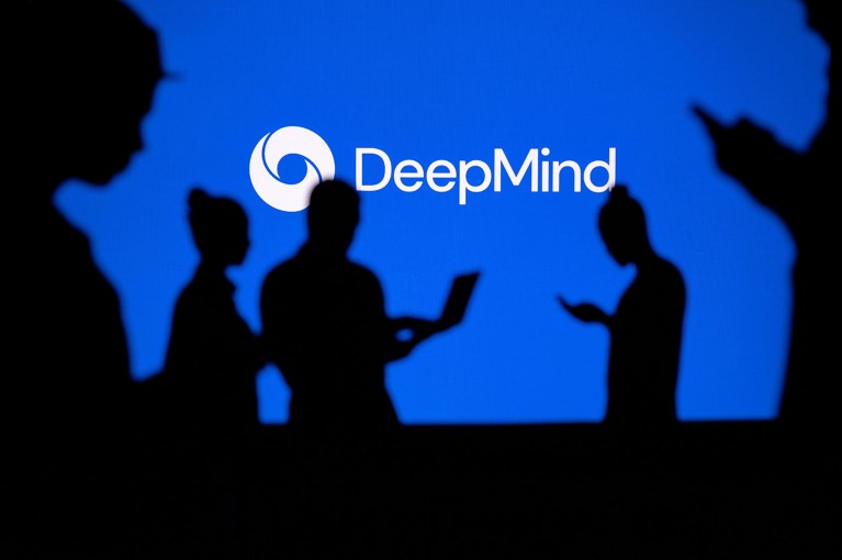 Silhouetted people using phones and laptops in front of a large Google DeepMind logo.