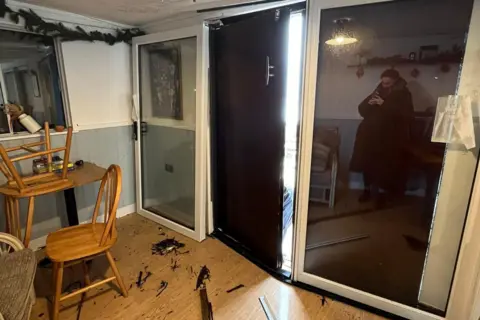 Emily Davidson An image showing the blown in doors at the Castle Beach Cafe in Falmouth