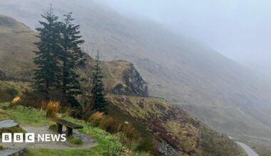 A mountain road on a wet and windy day