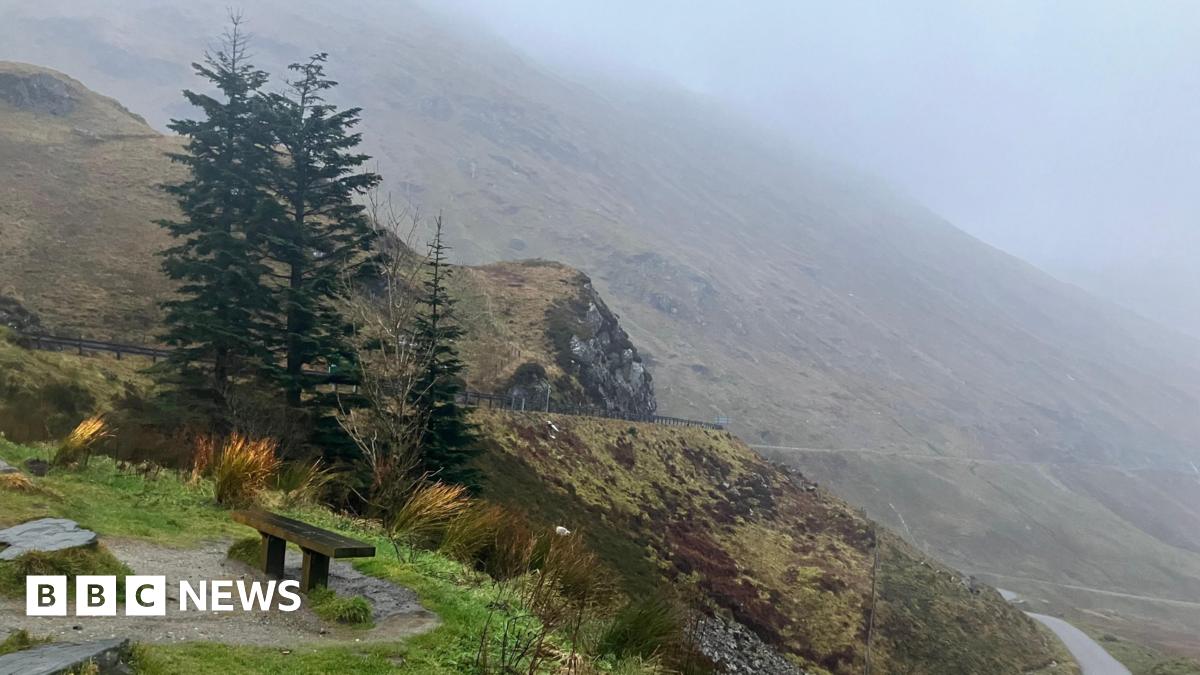 A mountain road on a wet and windy day