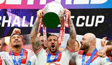 Hull KR captain Elliott Minchella lifts the Challenge Cup in 2025
