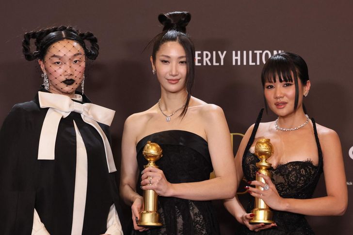 From left, Audrey Nuna, EJAE and Rei Ami pose in the press room during the 83rd Annual Golden Globes after winning the Best Original Song for 'Golden' from 'KPop Demon Hunters' at the Beverly Hilton hotel in Beverly Hills, Calif., Sunday (local time). The three provided the singing voices for fictional trio Huntrix in the K-pop-inspired film. AFP-Yonhap