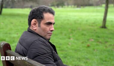 Ghanem al-Masarir in a park. 45 years old with black greying hair.