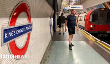 King's Cross platform shows passengers, Tube roundel and a train destined for Morden