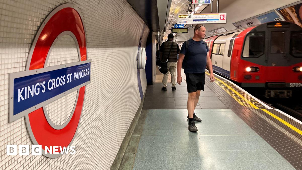 King's Cross platform shows passengers, Tube roundel and a train destined for Morden