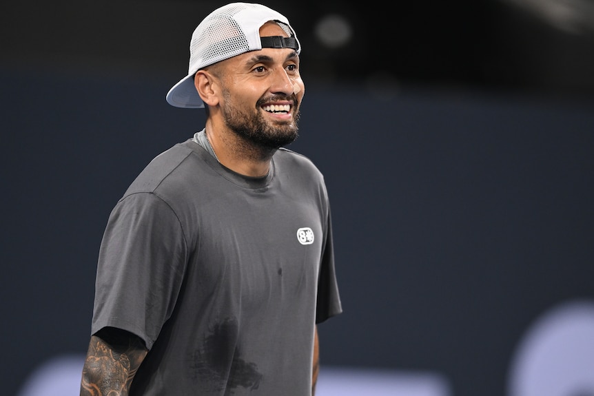 Nick Kyrgios smiles