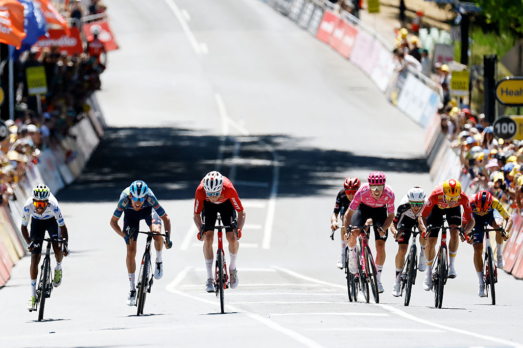 NORWOOD, AUSTRALIA - JANUARY 22: (L-R) Natnael Tesfatsion of Eritrea and Movistar Team, Filippo Zana of Italy and Team Soudal Quick-Step, Mauro Schmid of Switzerland and Team Jayco AlUla, Harry Sweeny of Australia and Team EF Education - EasyPost, Adam Yates of Great Britain and UAE Team Emirates, Andreas Kron of Denmark and Team Uno-X Mobility and Matteo Sobrero of Italy and Team Lidl - Trek sprint at finish line during the 26th Santos Tour Down Under 2026, Stage 2 a 148.1km stage from Norwood to Uraidla 495m / #UCIWT / on January 22, 2026 in Norwood, Australia. (Photo by Con Chronis/Getty Images)
