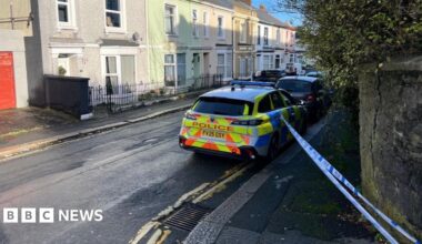A picture of the cordon in place at the scene. It is blue and white tape.