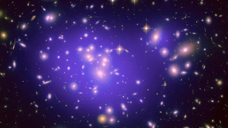 galaxy cluster Abell 1689, with the mass distribution of the dark matter in the gravitational lens shown in purple