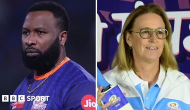 Kieron Pollard and Lisa Keightley wearing Mumbai Indians clothing