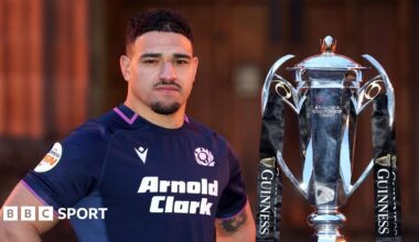 Sione Tuipulotu poses for photographs with the Six Nations trophy during the 2026 Guinness Men's Six Nations Launch Event at Edinburgh Castle