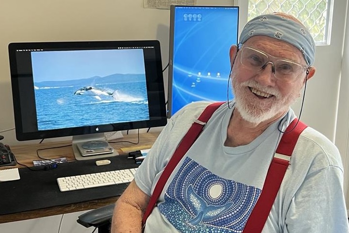An older man at a computer screen.